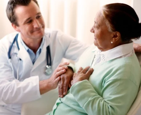 Doctor comforting an elderly patient during consultation | Associated Nephrology Consultants | Maplewood MN