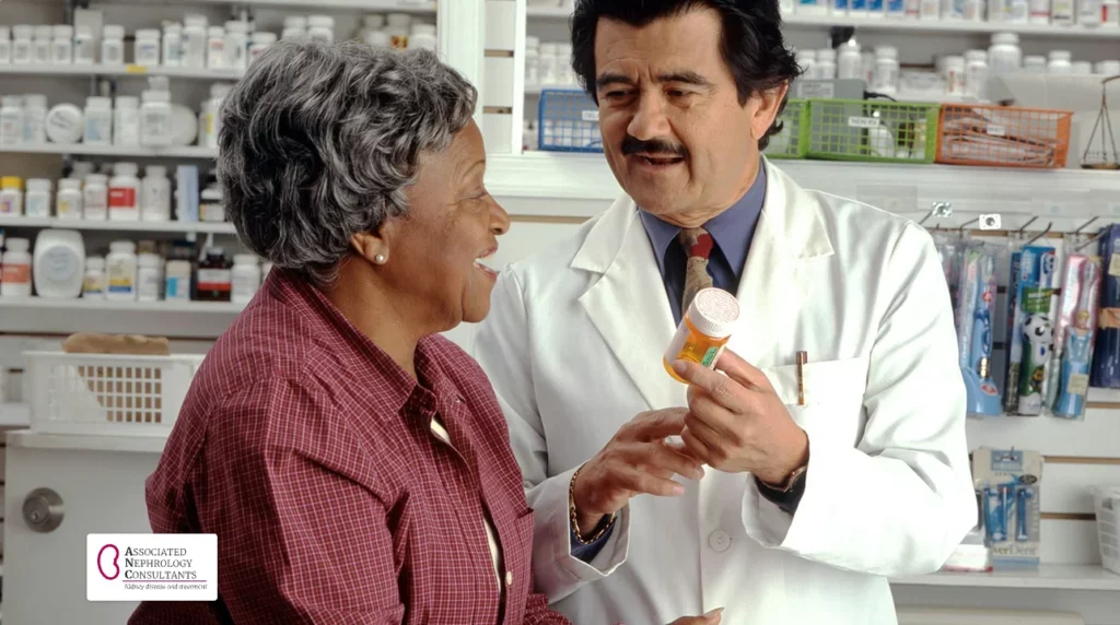 Pharmacist showing a prescription bottle to an older woman at a pharmacy counter